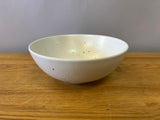 White bowl with brown specks
