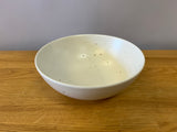 White bowl with brown specks