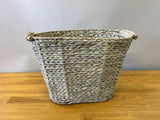 Grey-toned woven basket with handles