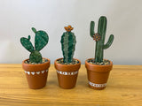 Stained glass cactus in terracotta pot with pebbles