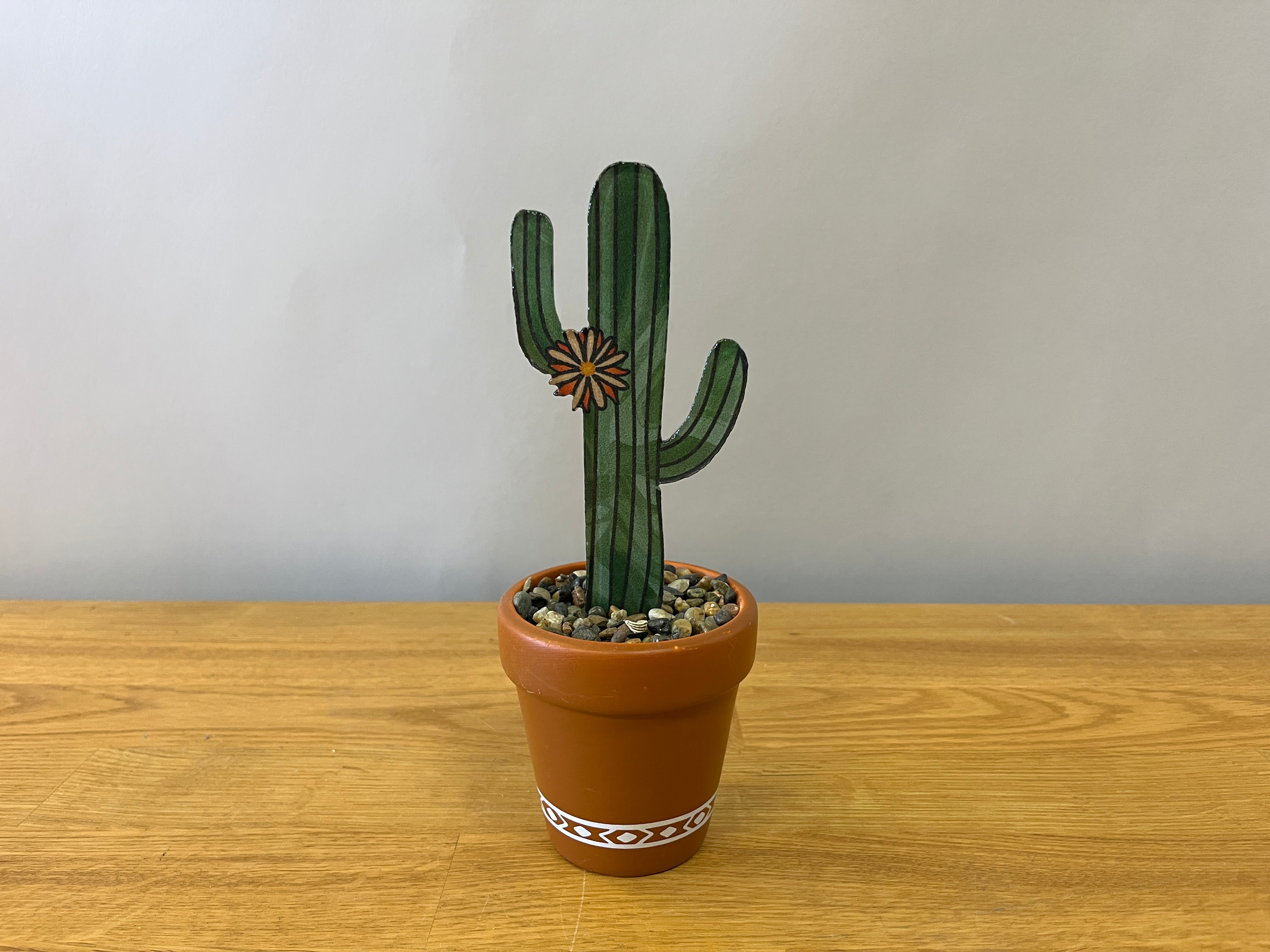 Stained glass cactus in pot terracotta pot with pebbles