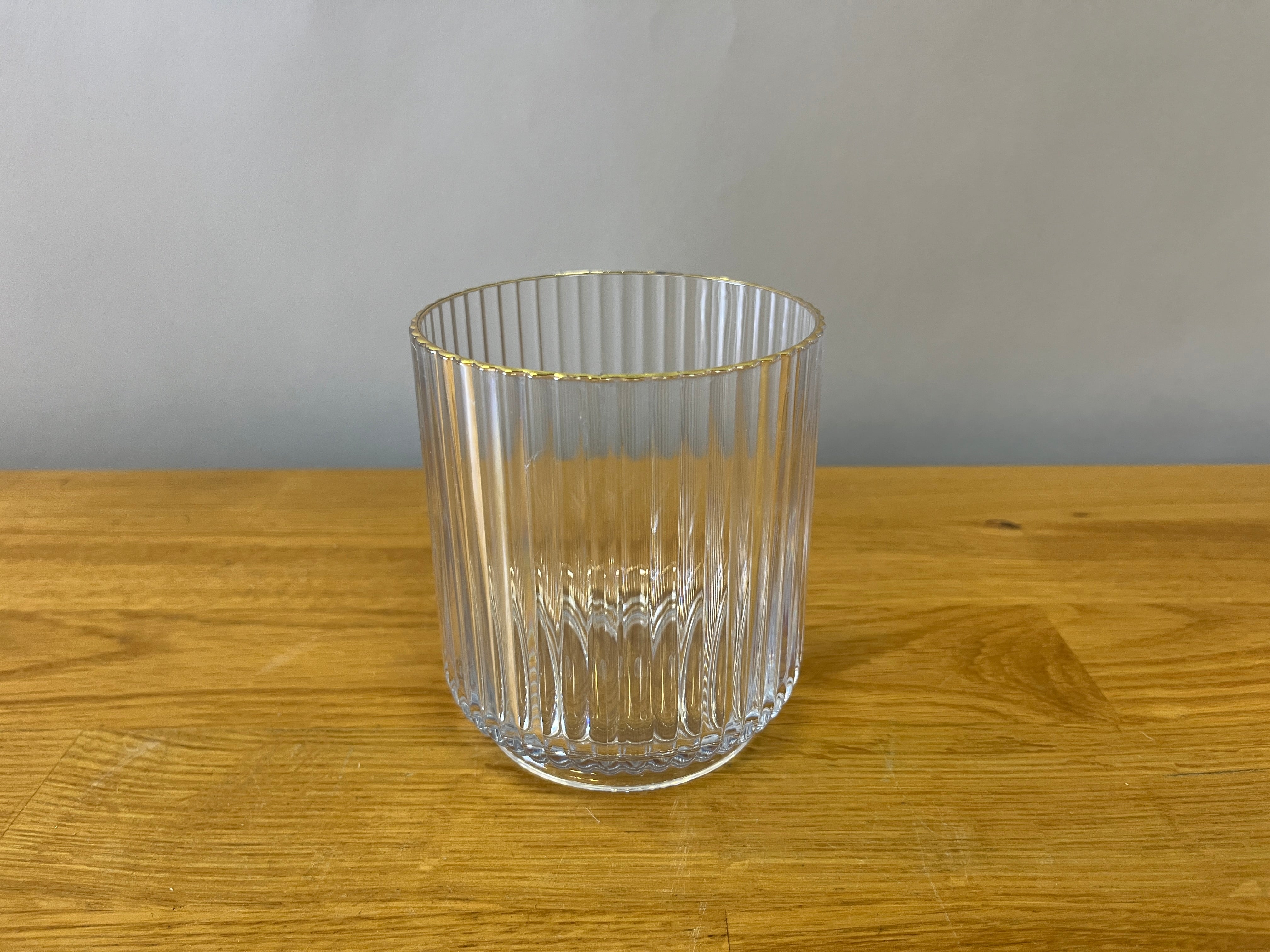 Plastic fluted drinking glass with gold edge