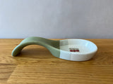 Green light grey and white spoon rest with apple photo