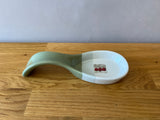 Green light grey and white spoon rest with apple photo