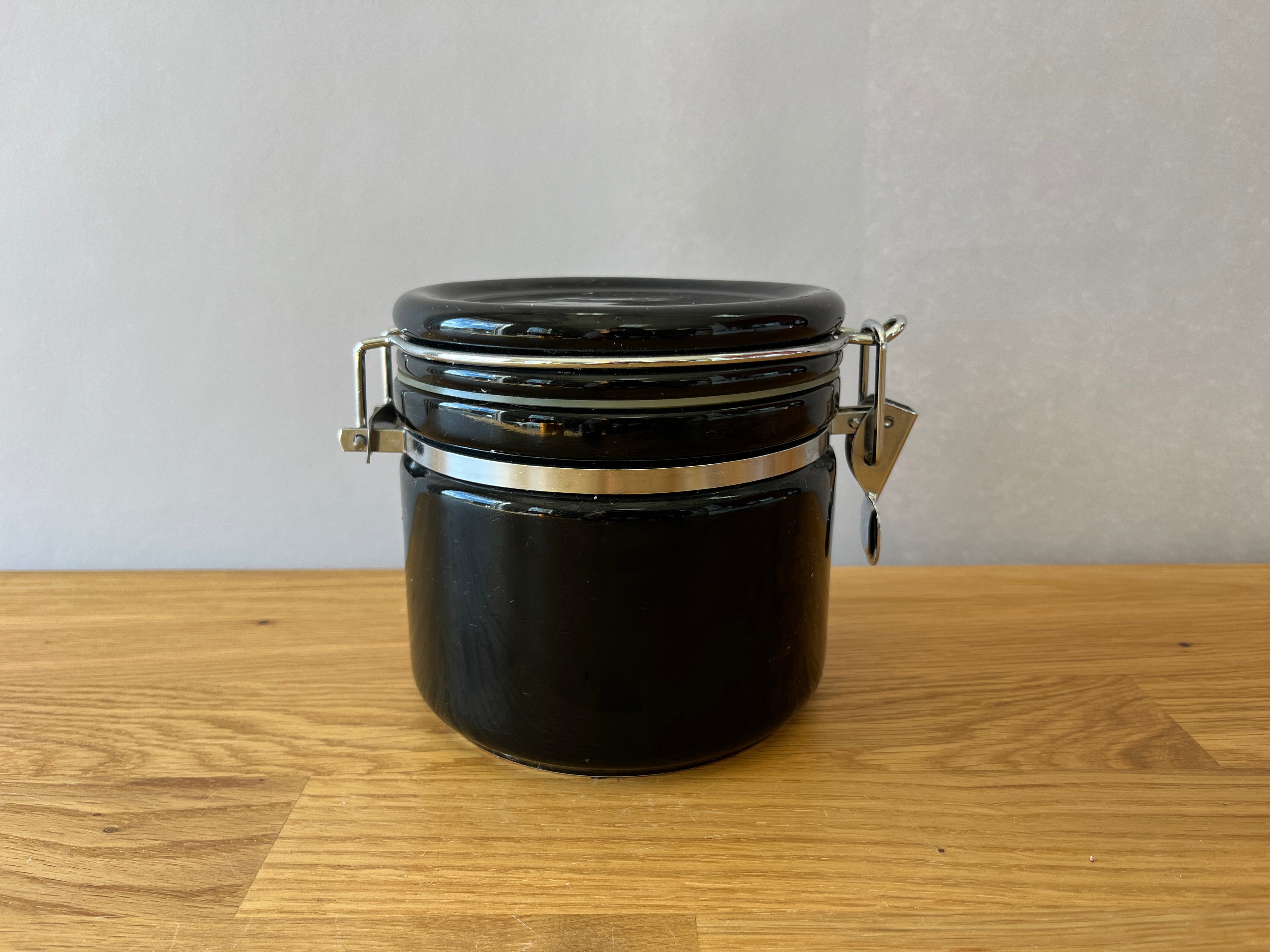 Black kitchen canister with silver latch