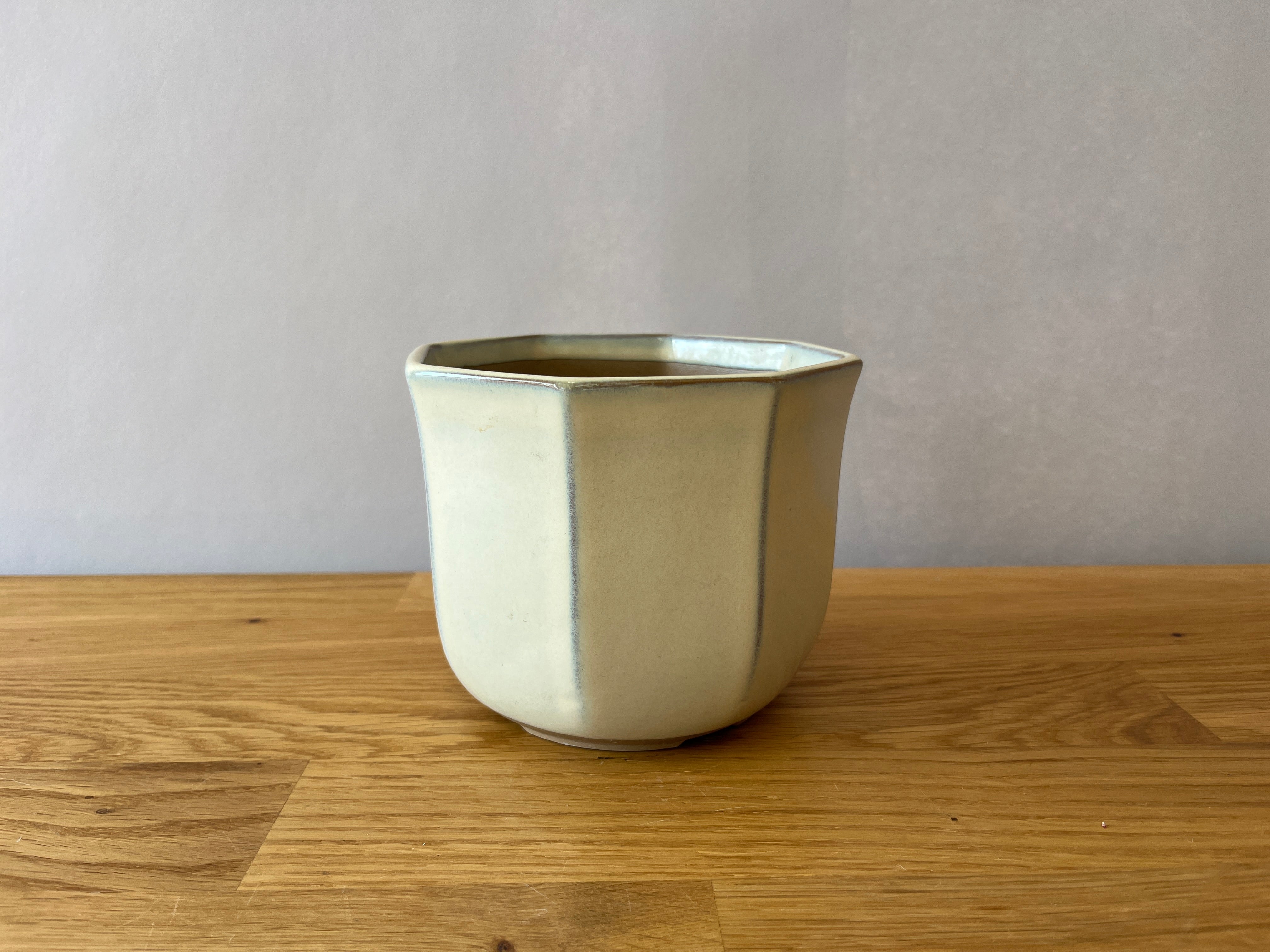 beige planter pot with vertical lines