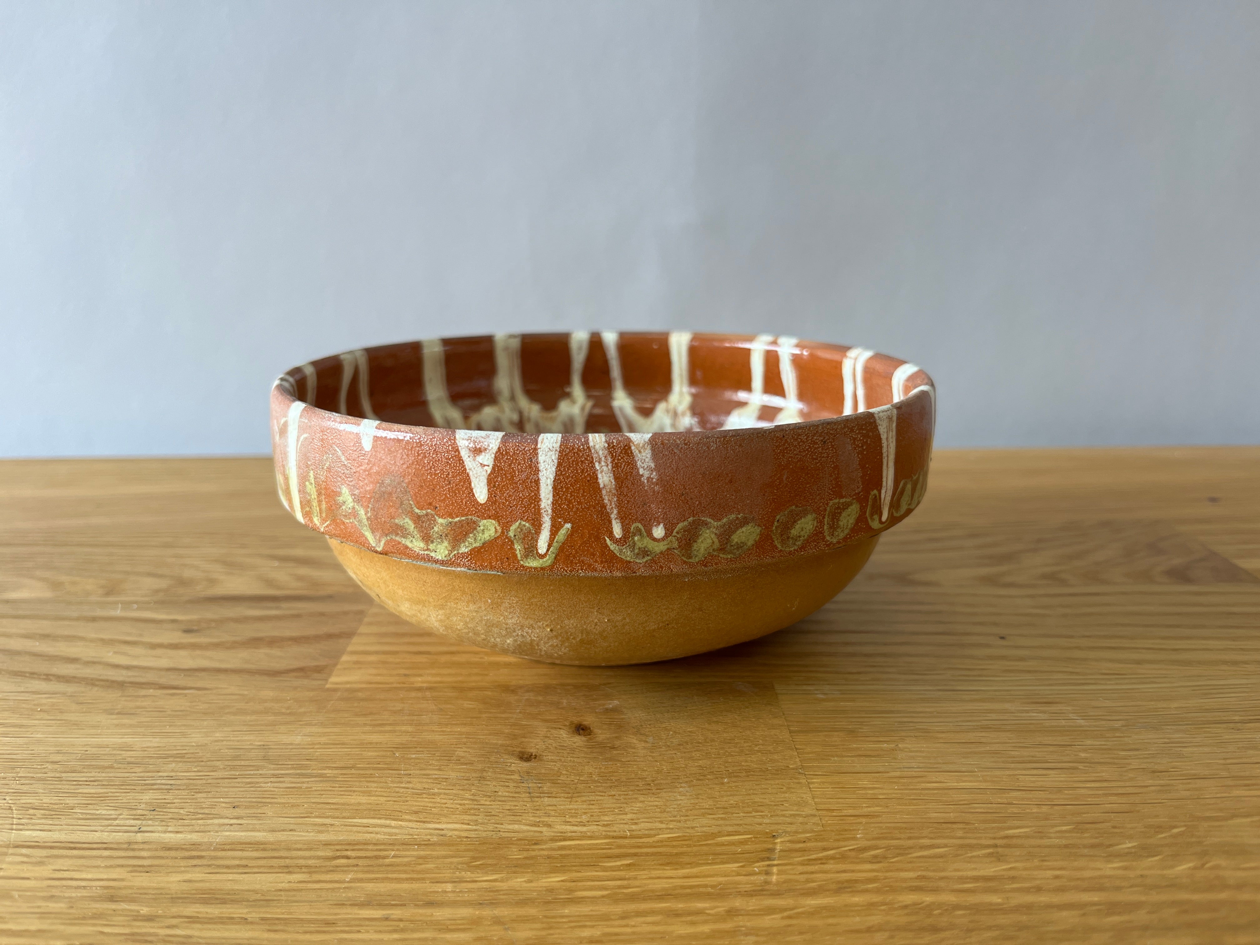 Terracotta catch all dish with painted green and white design