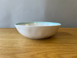 White Plastic Bowl with Blue Edge