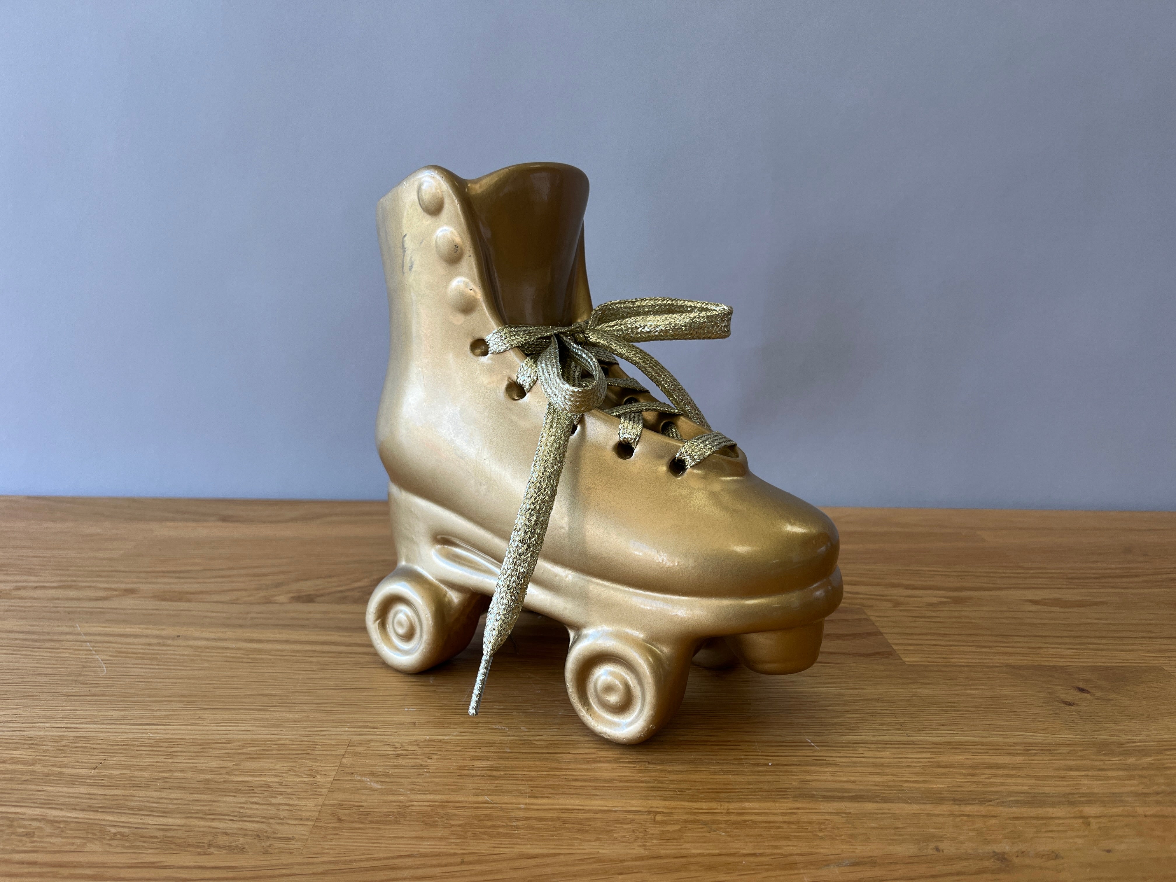 Gold Roller Blade Statue