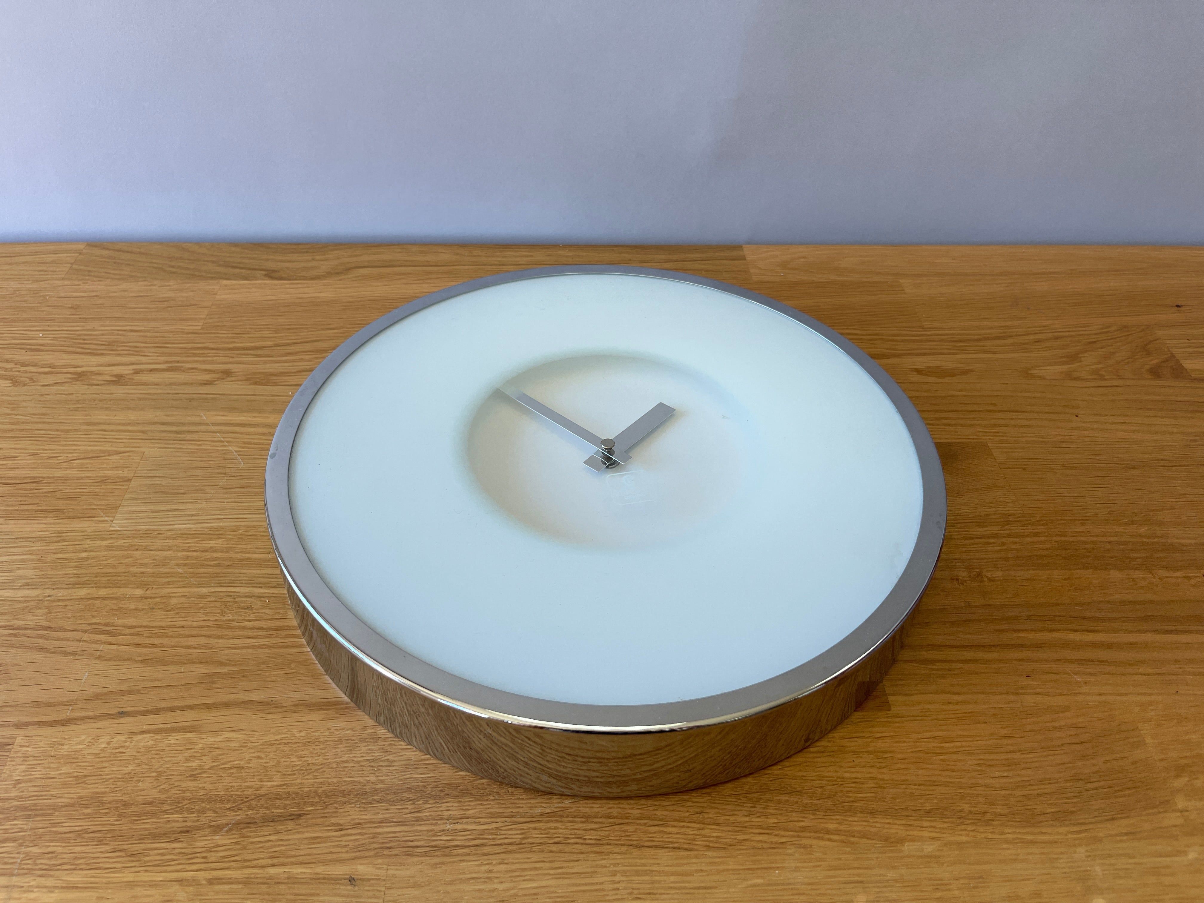 Silver and White Wall Clock